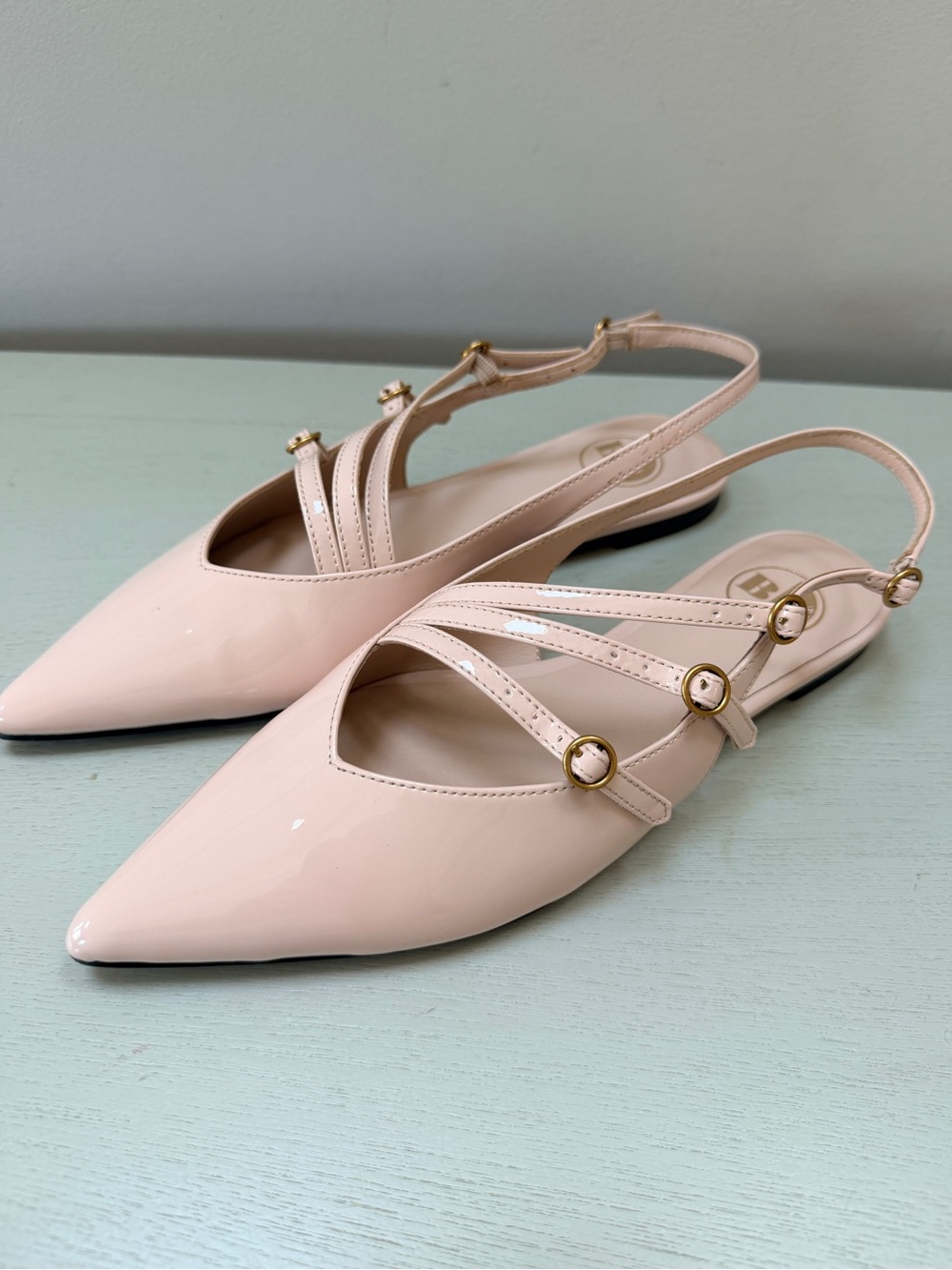 B2 Pointed-Toe Patent Slingback Flats in Blush Pink with Gold Buckles